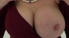 Hot wife slides her neckline down to reveal enormous knockers