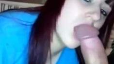 redhead girl sucking a massive cock