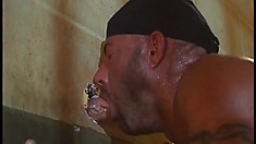 Hung muscular inmates suck each other off through a glory hole