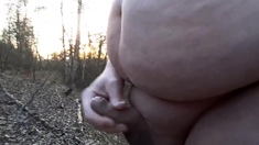 Chubby masturbates in the woods